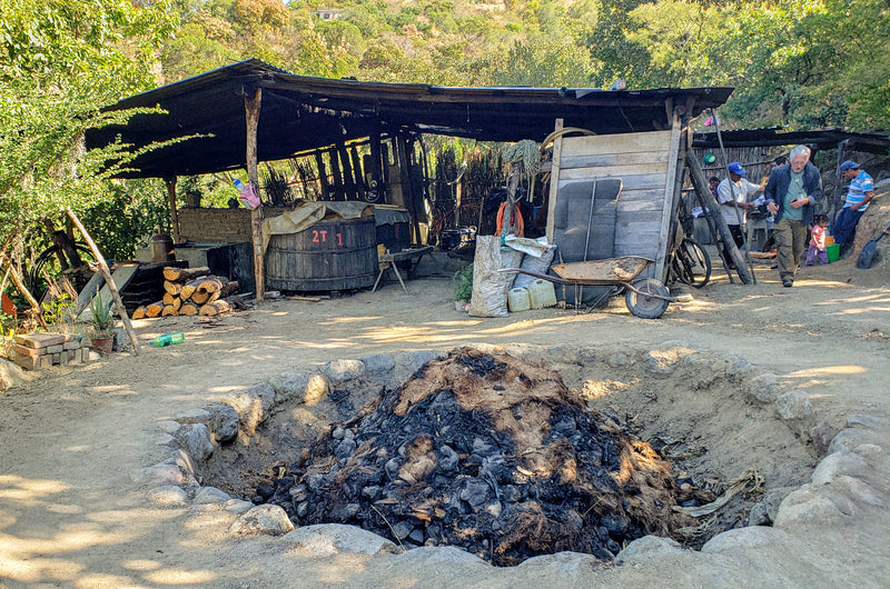 _<h2>Serafin's distillery</h2><p>Pit oven in the foreground. This photo gives a clear idea of the tiny scale of a lot of Oaxacan fanily distilleries</p>